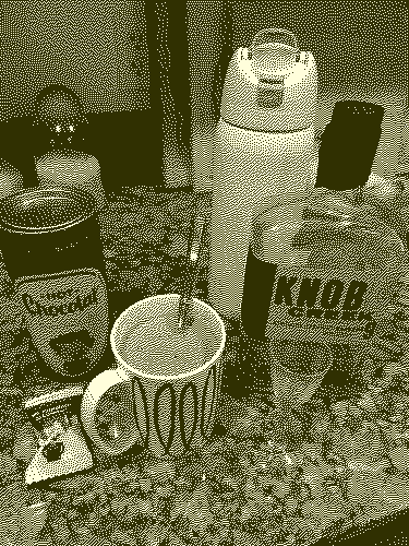dithered image of Irish hot chocolate ingredients: cocoa, bourbon, and a chocolate truffle treat from the No Chewing Allowed at the Union Square xmas market