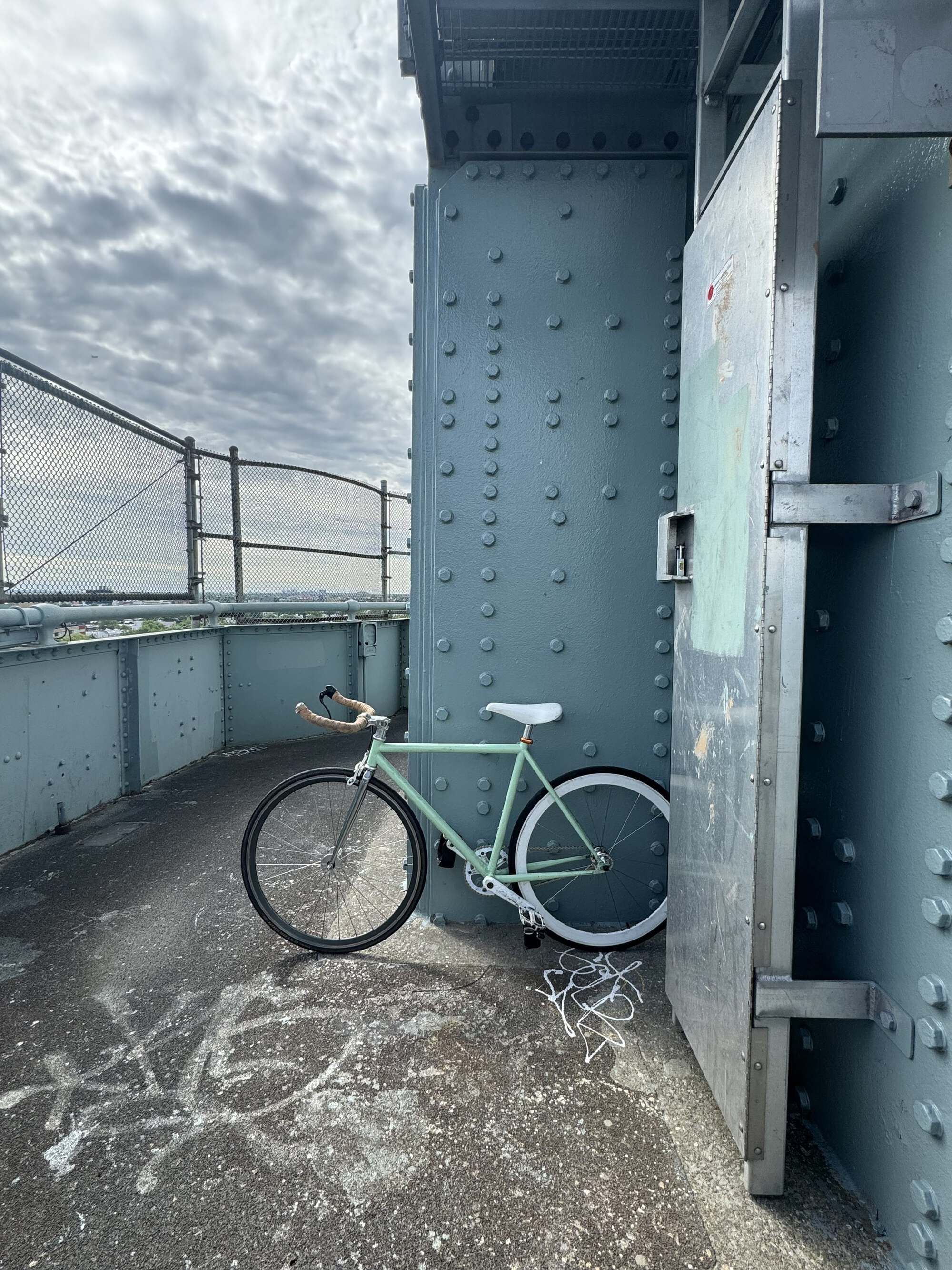 The bridge was totally empty of pedestrians, so I didn&rsquo;t feel too bad being That Guy riding a bike and snapping this pic 😎